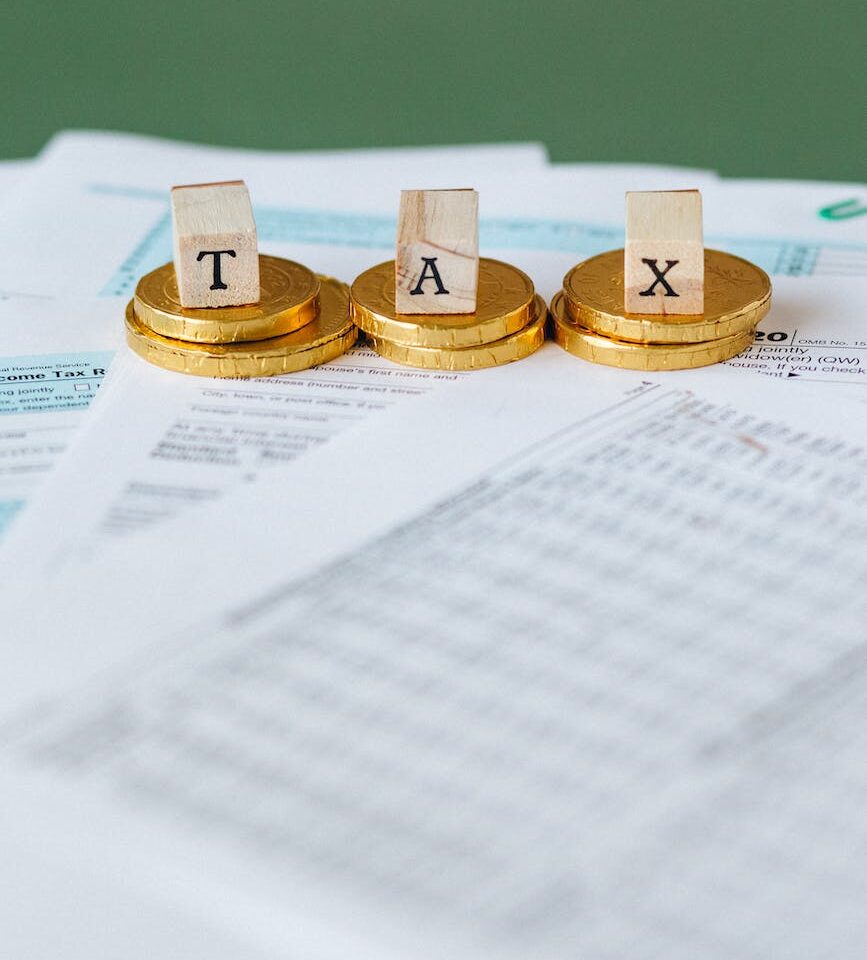 gold coins on top of documents